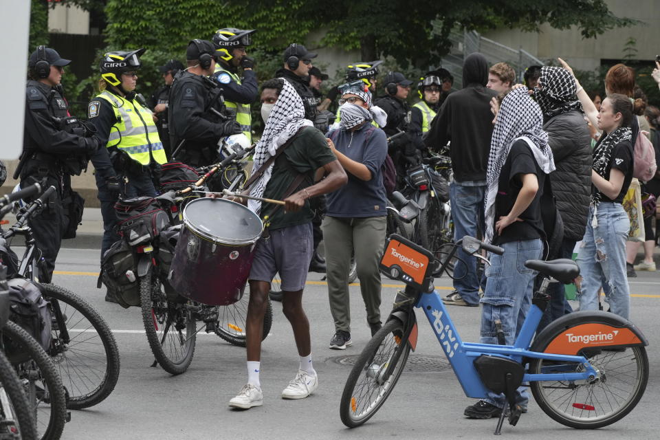 Police block protesters from the campus as security clears the pro-Palestinian encampment at McGill University in Montreal, Wednesday, July 10, 2024. (Christinne Muschi/The Canadian Press via AP)