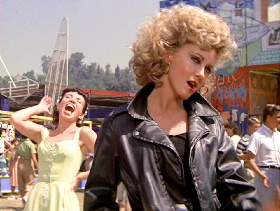 LOS ANGELES - JUNE 16: The movie "Grease", directed by Randal Kleiser. Seen here from left, Jamie Donnelly as Jan and Olivia Newton-John (in foreground, wearing tight black) as Sandy.  Initial theatrical release of the film, June 16, 1978. Screen capture. Paramount Pictures. (Photo by CBS via Getty Images)