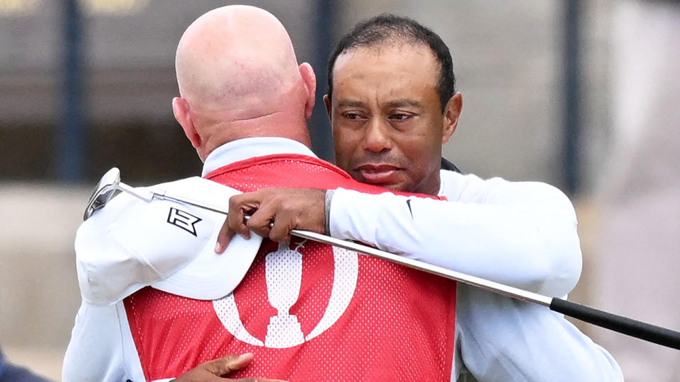 Seen here, an emotional Tiger Woods embraces his caddie Joe LaCava after missing the cut at the 2022 British Open. 