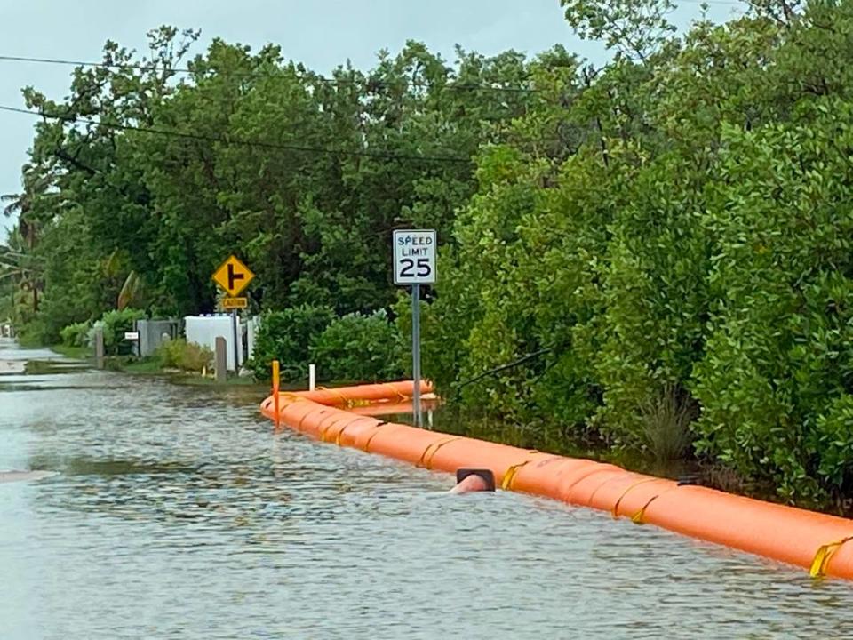 Heavy rains from Eta flooded the already flood-prone Stillwright Point subdivision in Key Largo. Temporary flood barriers Put in place by Monroe County to mitigate high tide flood damage line the street Monday, Nov. 9, 2020.