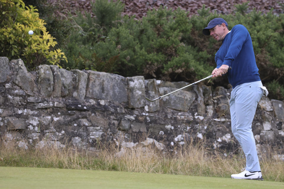 Rory McIlroy of Northern Ireland watches his chip shot during a practice round ahead of the British Open Golf Championships at Royal Troon golf club in Troon, Scotland, Tuesday, July 16, 2024. (AP Photo/Peter Morrison)