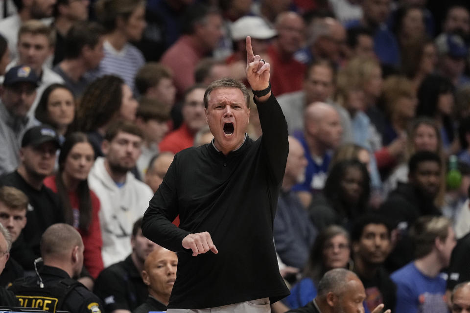 Kansas head coach Bill Self motions to his players during the first half of an NCAA college basketball game against BYU Tuesday, Feb. 27, 2024, in Lawrence, Kan. (AP Photo/Charlie Riedel)