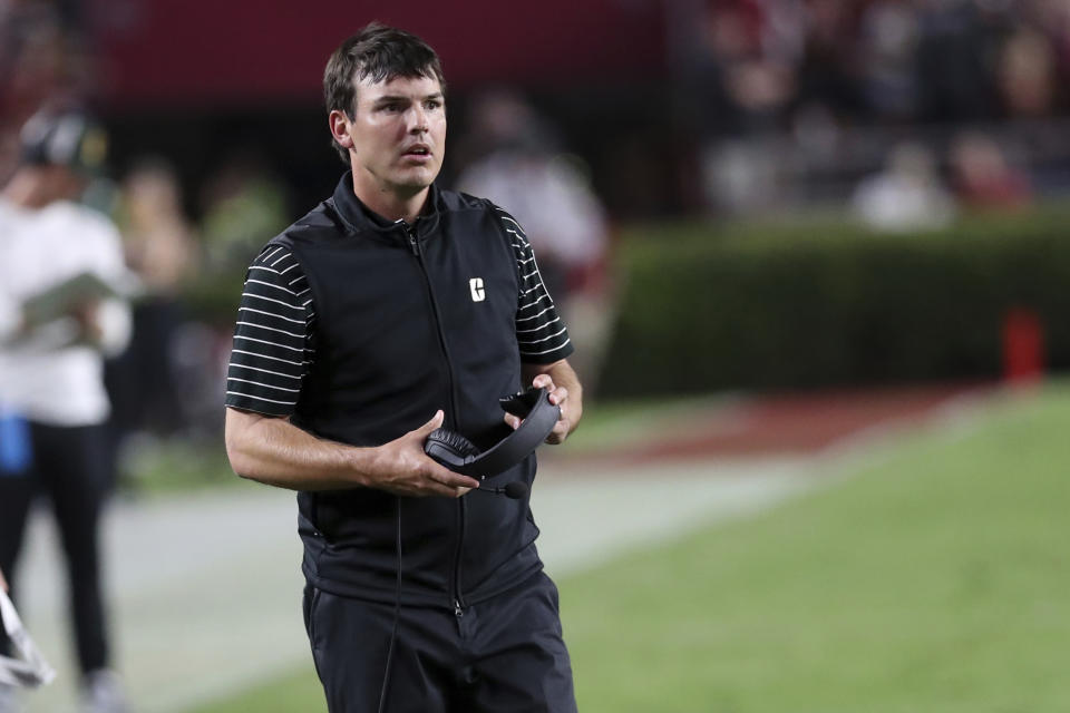 Charlotte head coach Will Healy takes his headsets off during an NCAA college football game against South Carolina on Saturday, Sept. 24, 2022, in Columbia, S.C. South Carolina won 56-20. (AP Photo/Artie Walker Jr.)