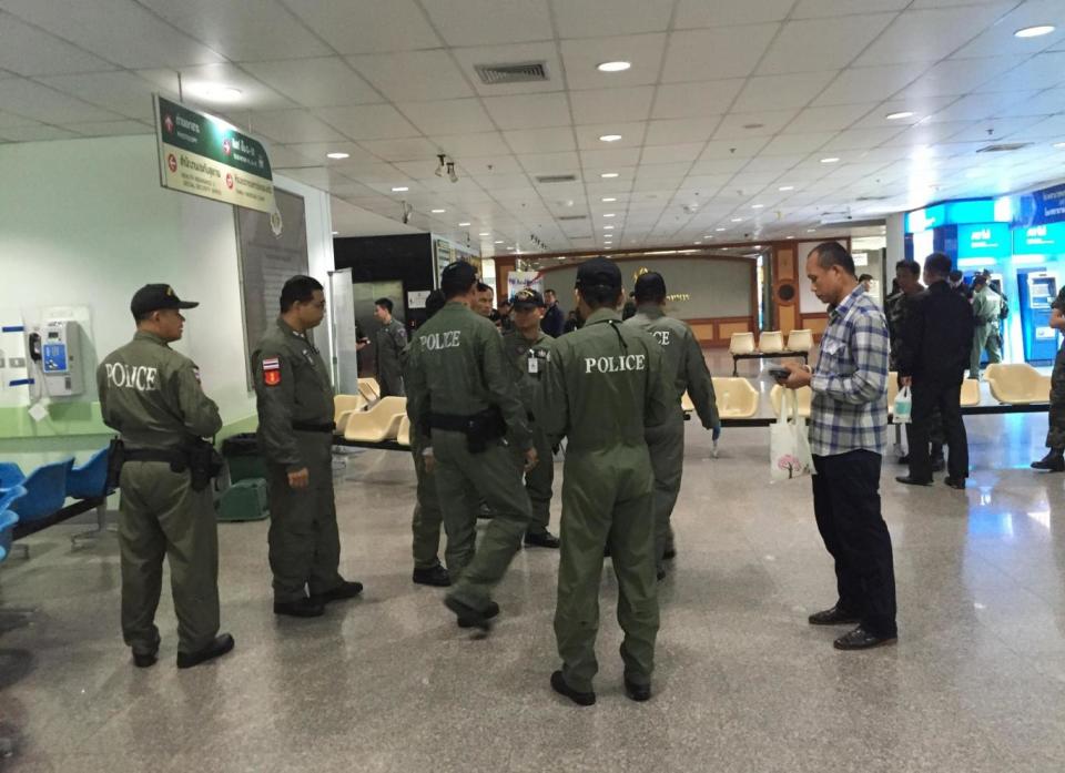 Police investigators work at the lobby of Phramongkutklao Hospital (AP)