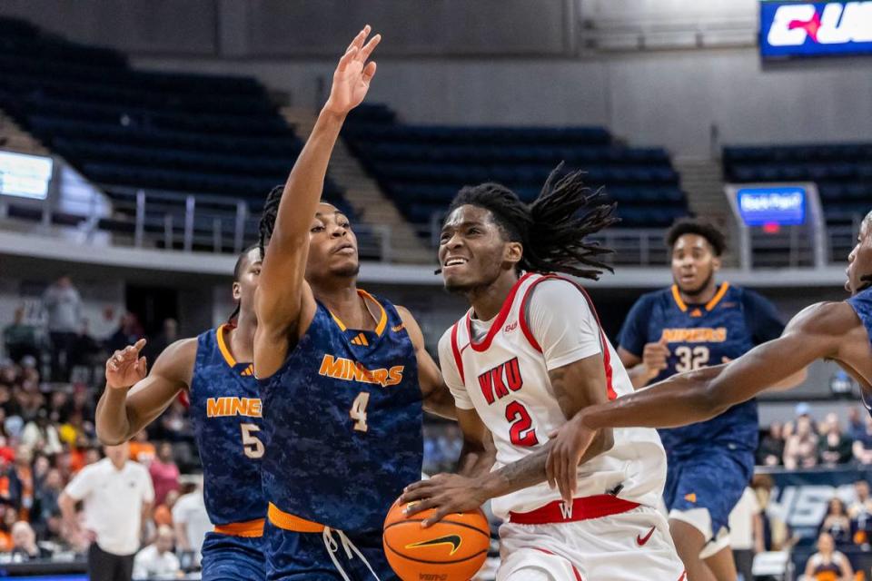 Western Kentucky guard Don McHenry (2) works against UTEP guard Corey Camper Jr. (4) during the second half the championship of the Conference USA Tournament.