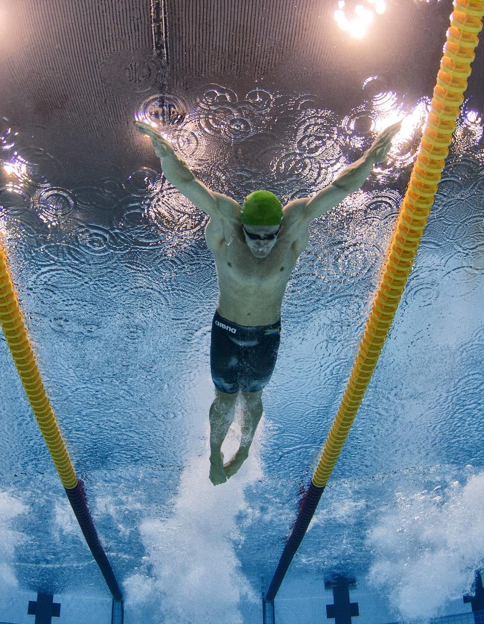 Winner and world record setter Cameron van der Burgh of South Africa on his way winning the men's 100m Breaststroke final during the Swimming competition held at the Aquatics Center during the London 2012 Olympic Games Swimming competition, London, Britain, 29 July 2012. Van der Burgh won in world record time of 58.46 seconds. Scozzoli placed 7th and Rickard 6th. EPA/PATRICK B. KRAEMER