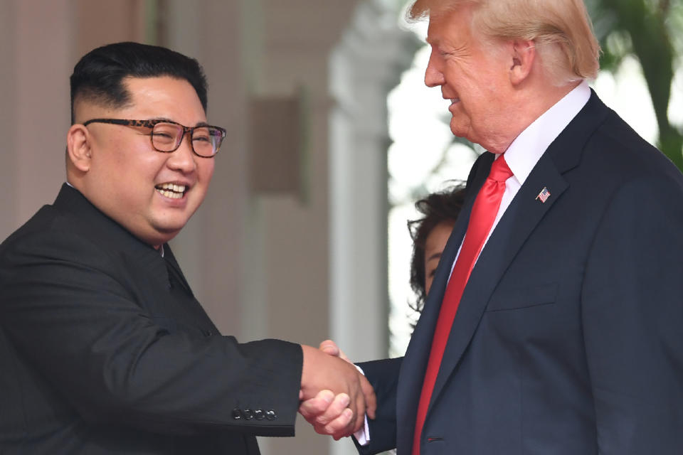 Trump&nbsp;and Kim shake hands.