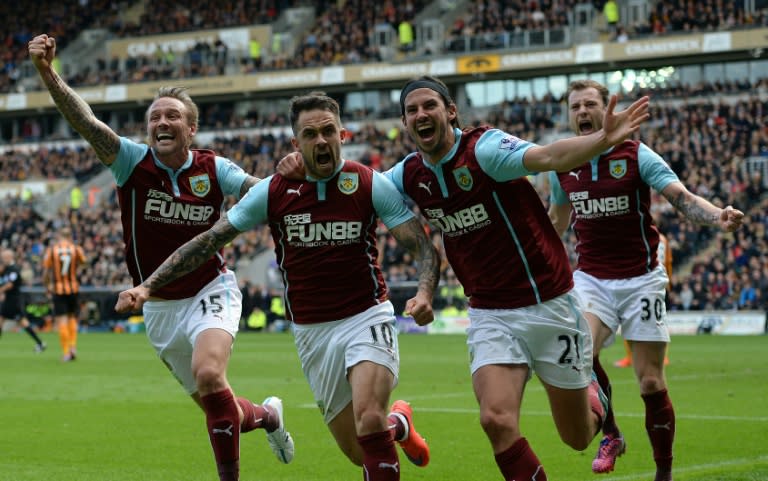 Burnley striker Danny Ings (2nd L) celebrates with teammates Matthew Taylor (L), George Boyd (2nd R) and Ashley Barnes after scoring during the Premier League match against Hull City at KC Stadium on May 9, 2015