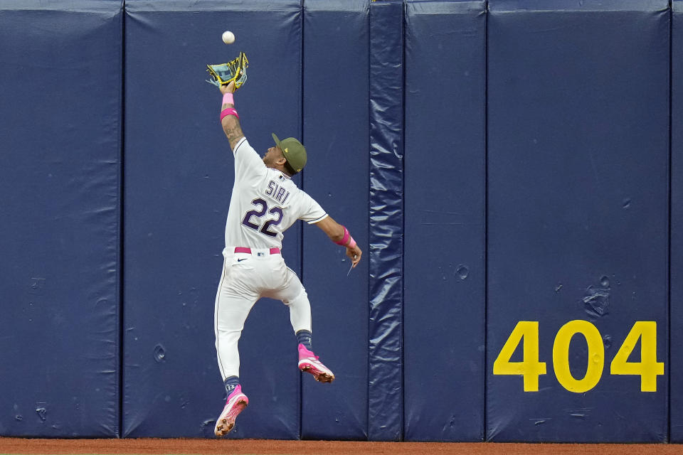 Tampa Bay Rays center fielder Jose Siri makes a leaping catch on a fly out by Milwaukee Brewers' Tyrone Taylor during the fifth inning of a baseball game Friday, May 19, 2023, in St. Petersburg, Fla. (AP Photo/Chris O'Meara)