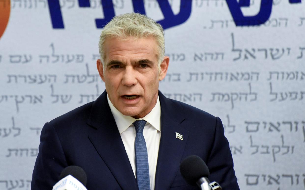 Yair Lapid, head of the centrist Yesh Atid party, delivers a statement to the press before the party faction meeting at the Knesset, Israel's parliament - Reuters/Debbie Hill/Reuters/Debbie Hill