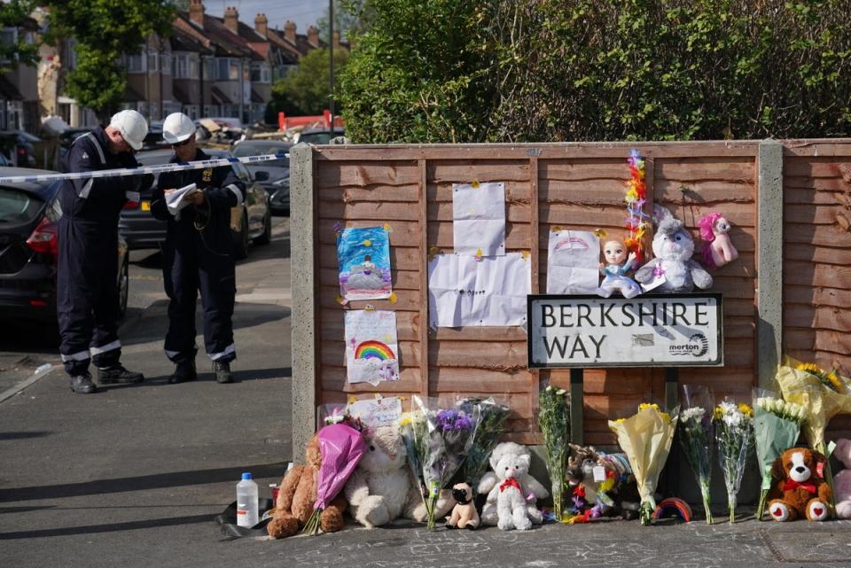 Flowers are laid near to the scene in Galpin’s Road (Dominic Lipinski/PA) (PA Wire)