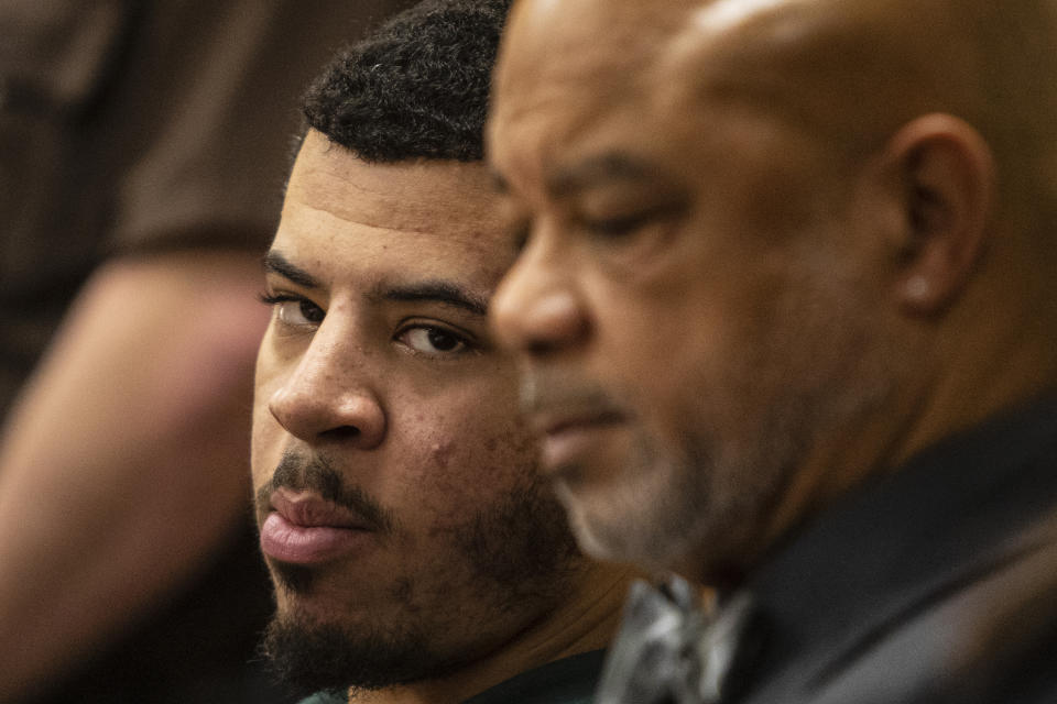 Jeremy Cuellar, 24, center, appears with his co-defendant, Kemia Hassel, 22, (not pictured) for a preliminary exam on a charge first-degree premeditated murder at the Berrien County Courthouse in St. Joseph, Michigan on Wednesday, Feb. 20, 2019. U.S. Army Sgt. Tyrone Hassel III, 23, was killed on Dec. 31, 2018. A police investigation revealed the pair, Cuellar and Hassel were having an affair and plotted to killed Tyrone to continue their relationship and reap financial benefits resulting from his death. Cuellar was stationed at Fort Stewart in Georgia where Kemia and Tyrone were also stationed, where they lived with their 1-year-old child. (Joel Bissell/Kalamazoo Gazette via AP)