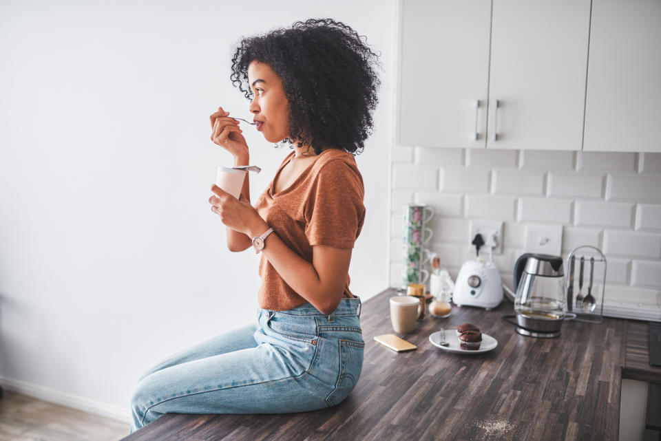 Woman eating breakfast as experts say it is important to help beat tiredness. (Getty Images)