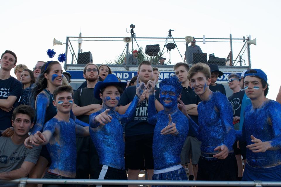 Florida State student Jack Henyecz (right center) has always been a super fan. During his time at Lake Howell High School he painted his entire body in glitter, similar to the FSU Glitter Guys, on game days.