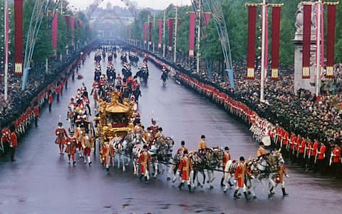 Her Majesty the Queen riding in the Gold State Carriage after her coronation - Credit: ITV