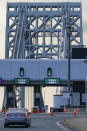 Cars pass through toll booths to use the George Washington Bridge in Fort Lee, N.J., Friday, July 8, 2022. The busy bridge connecting New Jersey and New York City is moving to cashless tolls. Beginning July 10, drivers paying cash tolls will have their license plates scanned and will be billed by mail. (AP Photo/Seth Wenig)