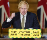 In this photo issued by 10 Downing Street, Britain's Prime Minister Boris Johnson speaks during a media briefing on coronavirus in Downing Street, London, Sunday May 24, 2020. Boris Johnson says he won't fire his chief aide Dominic Cummings for allegedly violating the national coronavirus lockdown rules that he helped to create. (Andrew Parsons/10 Downing Street via AP)