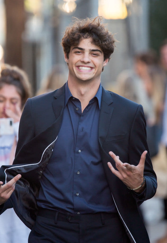 Noah Centino smiling and walking