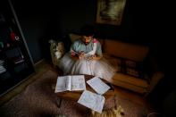 Cayan Hakiki studies for the university entrance exams at their home in Ankara