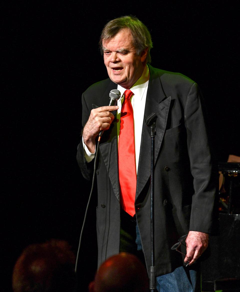 Garrison Keillor smiles while performing "Old Friends" at Pioneer Place in St. Cloud, Minn.