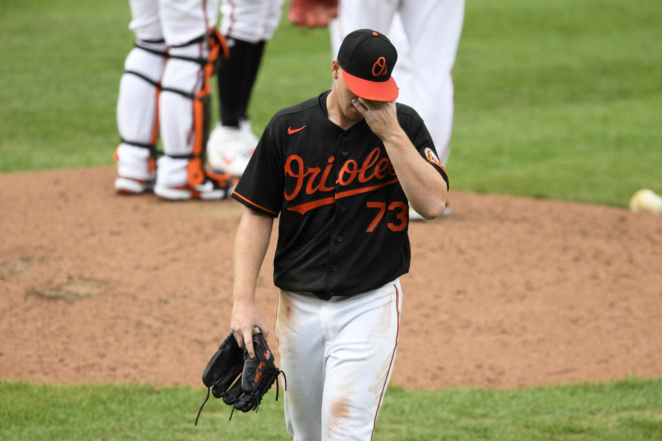 Baltimore Orioles starting pitcher Tom Eshelman walks toward the dugout after he was pulled during the third inning of the first baseball game of the team's doubleheader against the New York Yankees, Friday, Sept. 4, 2020, in Baltimore. (AP Photo/Nick Wass)