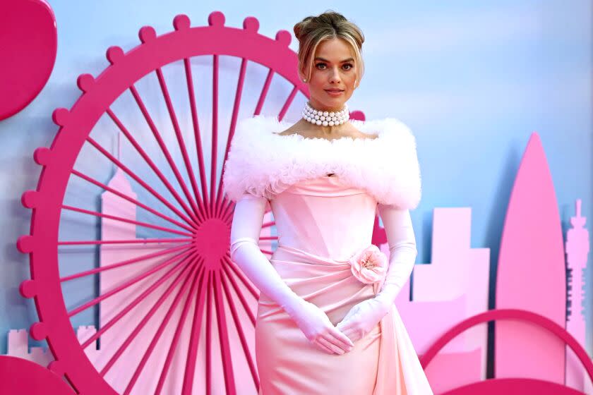 Australian actress Margot Robbie poses on the pink carpet upon arrival for the European premiere of "Barbie" in London