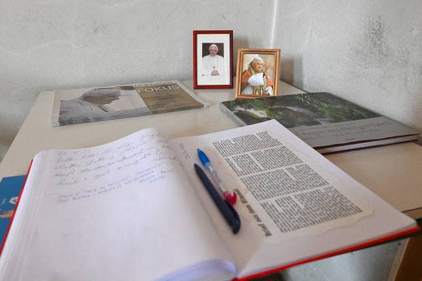 A book in which parishioners can write down their thoughts and prayers for Pope Emeritus Benedict XVI is seen at the Catholic St Oswald church in Marktl, southern Germany, on 29 December 2022 (AFP via Getty Images)