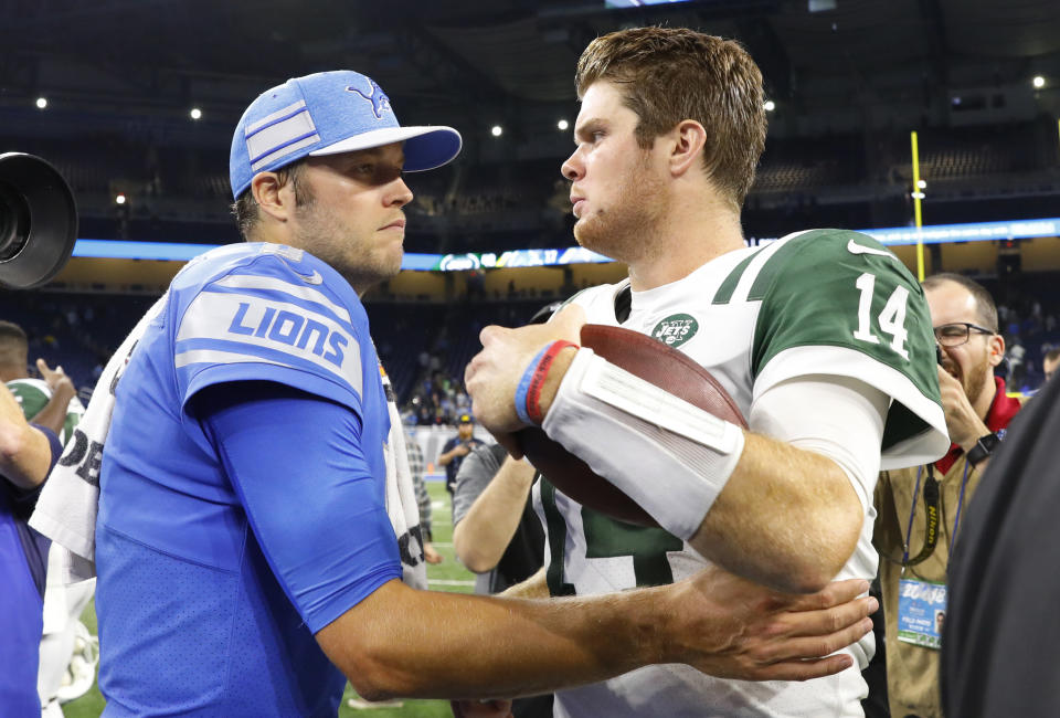 Detroit Lions quarterback Matthew Stafford, left, and New York Jets quarterback Sam Darnold talk after an NFL football game in Detroit, Monday, Sept. 10, 2018. The Jets won 48-17. (AP Photo/Rick Osentoski)