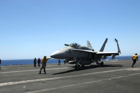 F/A-18 fighter jet takes off at the USS Harry S. Truman aircraft carrier in the eastern Mediterranean Sea. REUTERS/Andrea Shalal