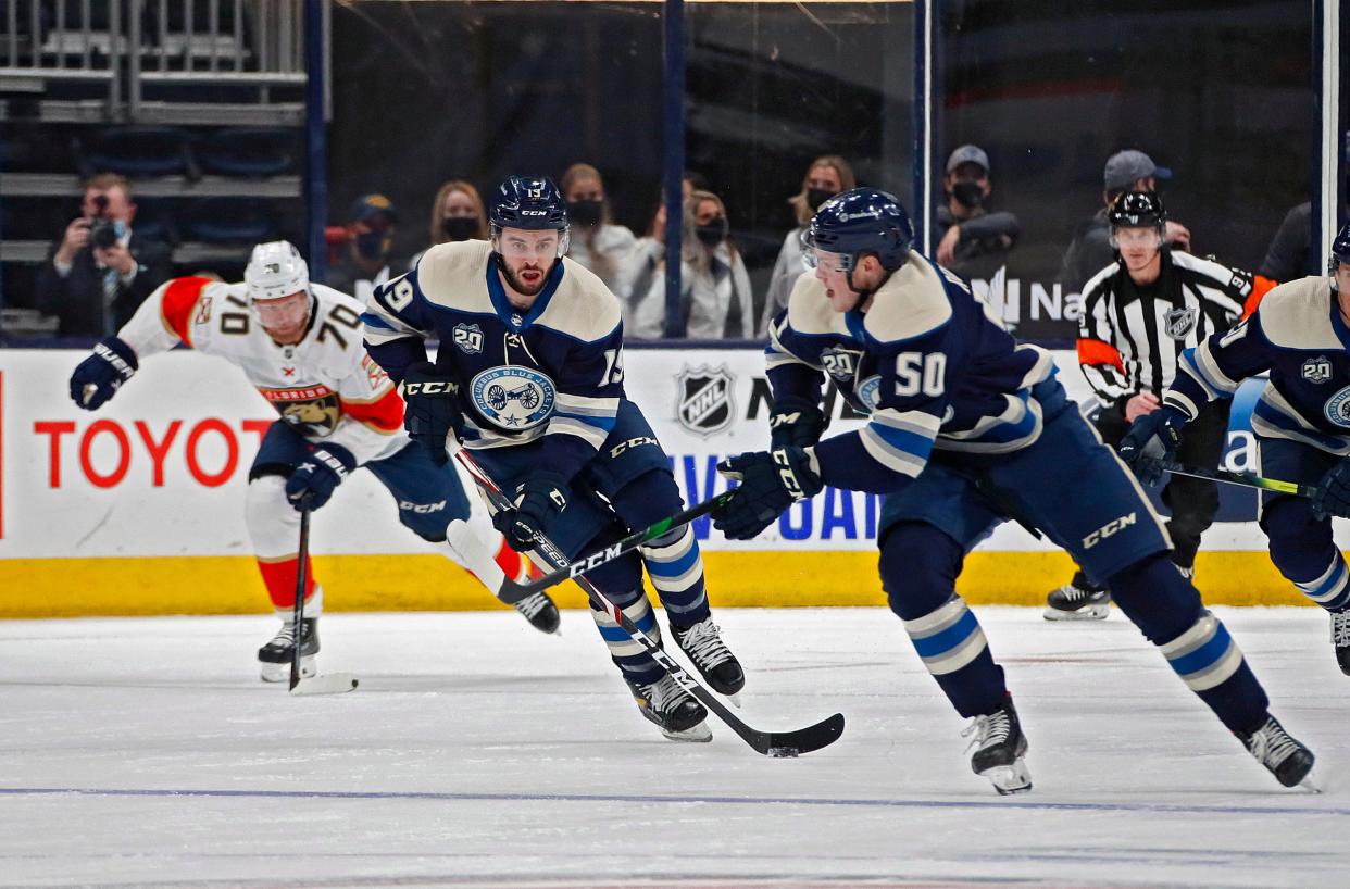 Columbus Blue Jackets center Liam Foudy (19) passes the puck to Columbus Blue Jackets left wing Eric Robinson (50) against Florida Panthers during the first period of their NHL game at Nationwide Arena in Columbus, Ohio on January 26, 2020. 