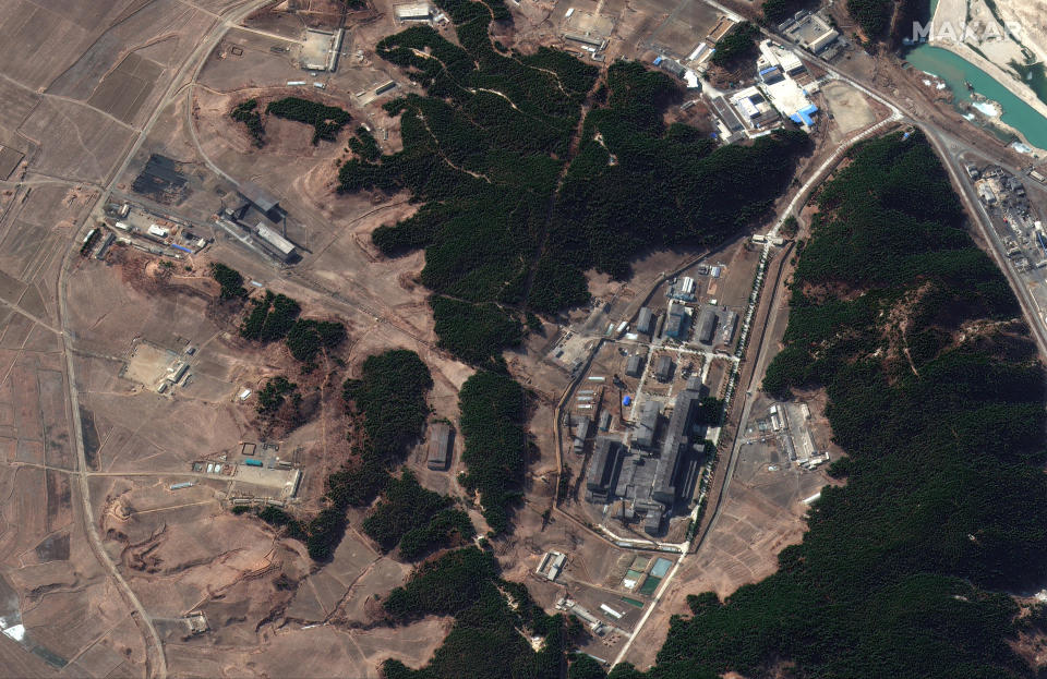 This Tuesday, March 2, 2021 satellite image provided by Maxar Technologies shows a steam plant, left, and North Korea’s main atomic complex, right, in Yongbyon, North Korea. Smoke was observed emanating from the plant’s smokestack at various times from late February and early March. North Korea may be trying to extract plutonium to make more nuclear weapons at the complex, recent satellite photos indicated, weeks after leader Kim Jong Un vowed to expand his nuclear arsenal. (Satellite image ©2021 Maxar Technologies via AP)