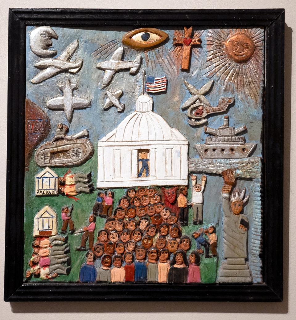 Elijah Pierce, "Watergate," c. 1975, carved and painted wood relief with glitter. Museum purchase.