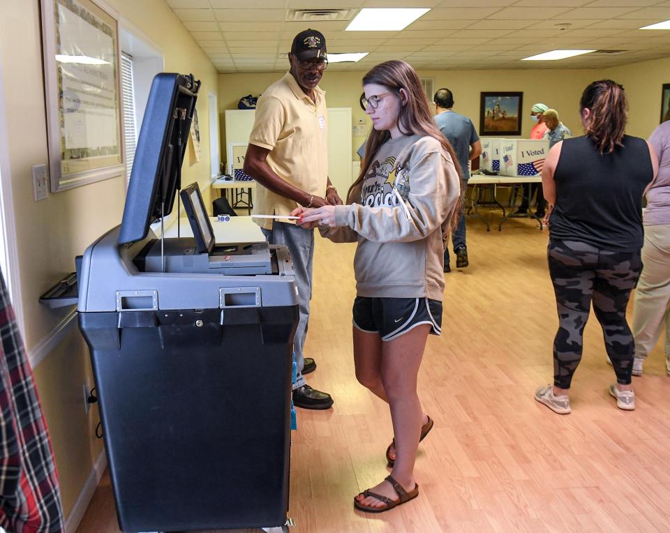 Ashley Berry of Anderson casts her ballot near Poll Manager Warren Kelley during midterm elections voting in Precinct 6/1 at Trinity United Methodist Church in Anderson, in Upstate of South Carolina Tuesday, November 8, 2022.