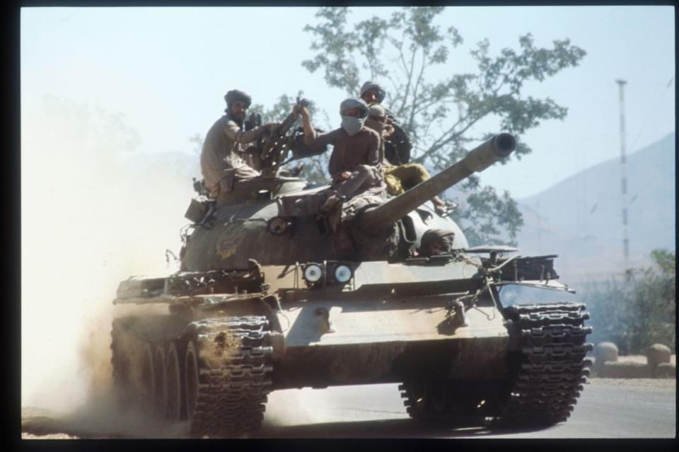 <div class="inline-image__caption"><p>Members of the Taliban army ride atop a tank October 15, 1996 near Kabul, Afghanistan. </p></div> <div class="inline-image__credit">Roger Lemoyne/Liaison/Getty</div>