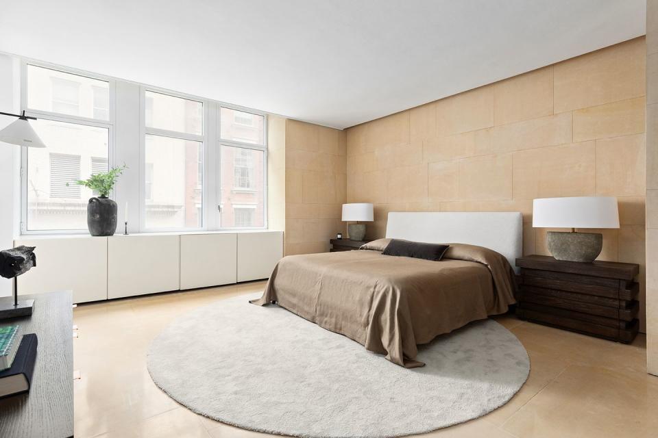 5) Natural light floods the minimalist master bedroom suite.