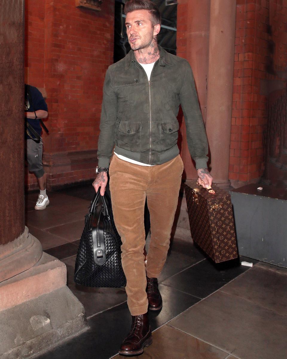 Yes, David Beckham's fit is big—but the Louis Vuitton suitcase is massive.