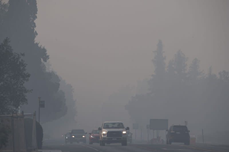 Cars drive through the smoke along Highway 29 in Calistoga, California on September 29, 2020. Wildfires have undercut progress made in cleaning America's air, and between 2000 and 2020 caused an increase of 670 premature deaths each year in the West, researchers reported Monday. File Photo by Terry Schmitt/UPI