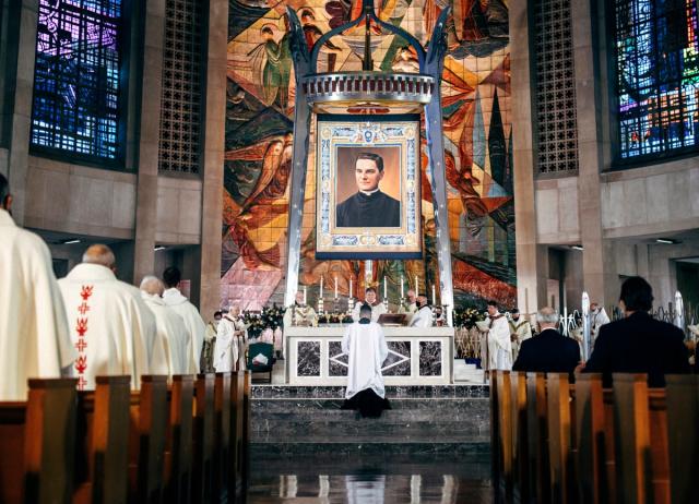 In this photo provided by the Archdiocese of Hartford, a tapestry showing Rev. Michael McGivney hangs above the alter at the Cathedral of St. Joseph in Hartford, Conn, Saturday, Oct. 31, 2020. The late Connecticut priest who founded the Knights of Columbus moved a step closer to possible sainthood with his beatification Saturday, as authorized by Pope Francis. (Archdiocese of Hartford via AP) (Archdiocese of Hartford)