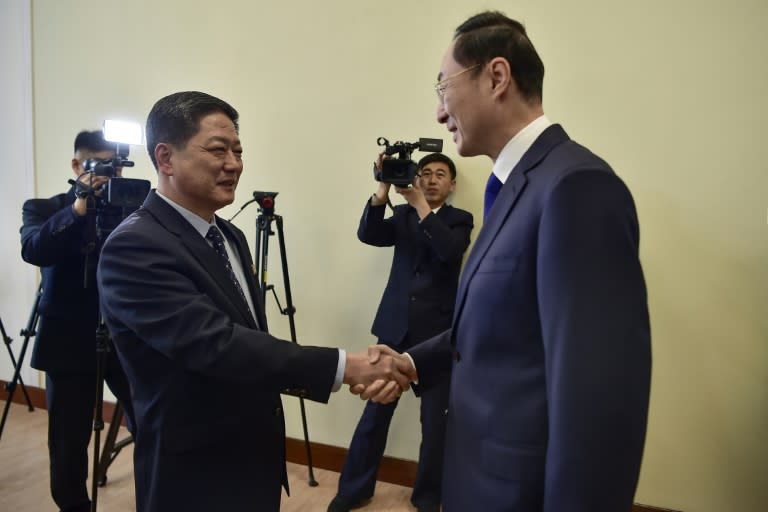 China's Vice Foreign Minister Sun Weidong (R) shakes hands with North Korea's Vice Foreign Minister Pak Myong Ho at the People's Palace of Culture in Pyongyang (KIM Won Jin)