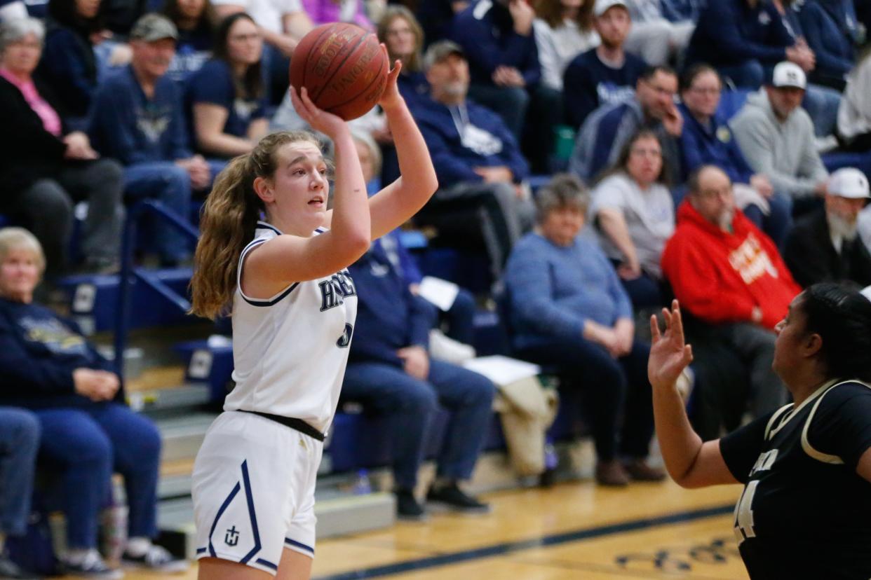 Hayden senior Lauren Sandstrom (5) aims a three-point shot against Topeka High in the second half of the senior night game Friday, Feb. 16, 2024.