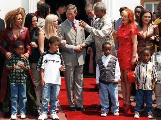 Nelson Mandela and Prince Charles shake hands, flanked by the Spice Girls, in Pretoria in 1997 (AFP/Getty)