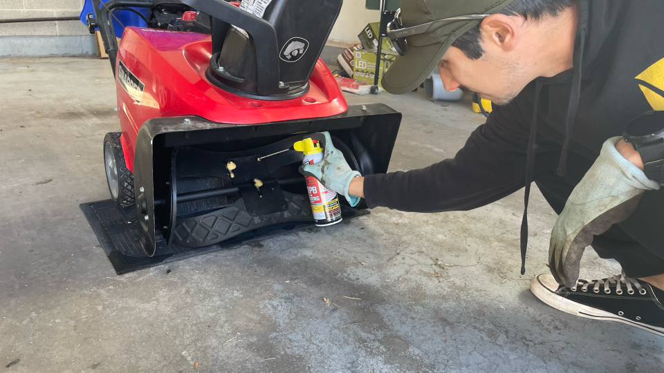 Spraying mouth of snow blower