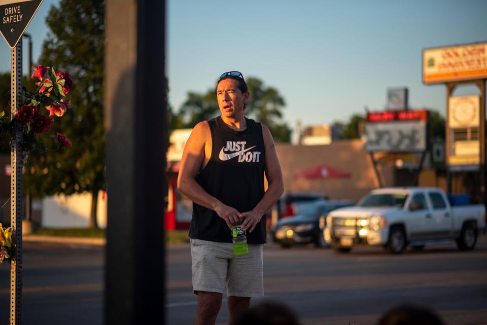 Robert Johnson addresses a crowd at a vigil for Jacob James, who was killed in an officer-involved shooting in Sioux Falls, on Wednesday, August 10, 2022.