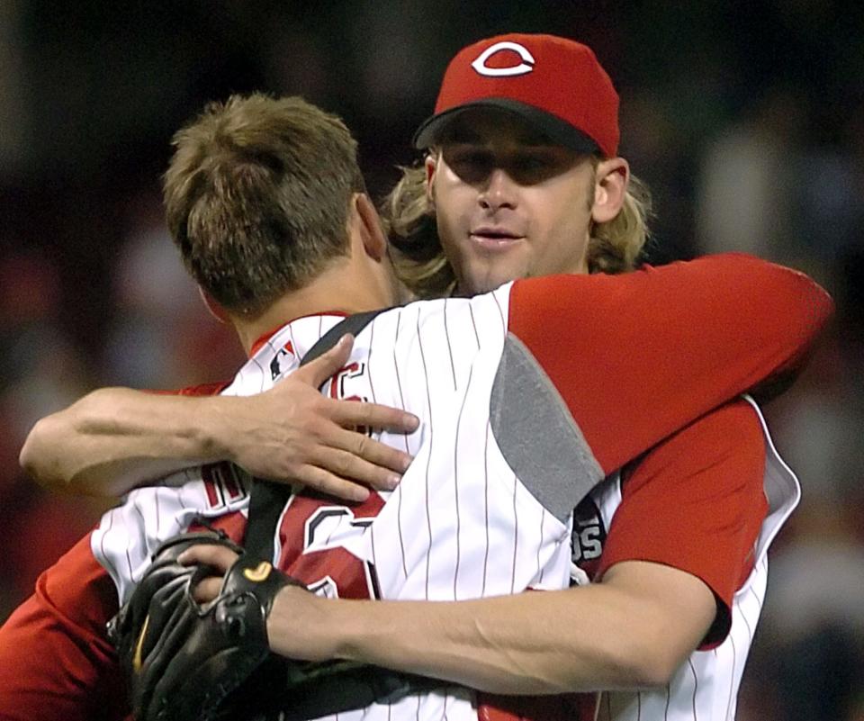 Cincinnati Reds' pitcher Bronson Arroyo, right, hugs catcher David Ross, left, after the final out of his complete game taking the Reds to a 6-1 win over the St.Louis Cardinals during their baseball game, Monday, May 1, 2006 in Cincinnati. (AP Photo/Tony Tribble)