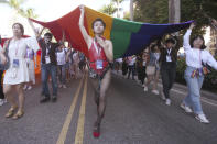 Participants march through a street during a pride parade in Taipei, Taiwan, Saturday, Oct. 31, 2020. (AP Photo/Chiang Ying-ying)