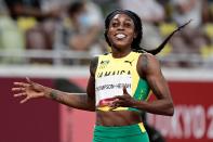 <p>Jamaica's Elaine Thompson-Herah wins the women's 200m final during the Tokyo 2020 Olympic Games at the Olympic Stadium in Tokyo on August 3, 2021. (Photo by Javier SORIANO / AFP) (Photo by JAVIER SORIANO/AFP via Getty Images)</p> 