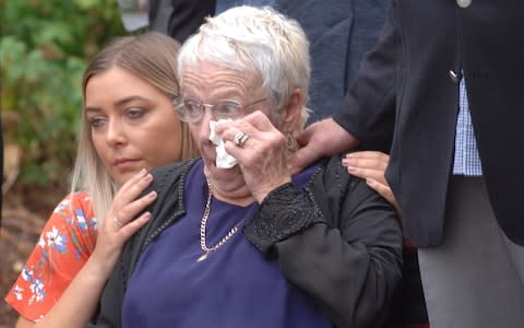 Beth Rose, great granddaughter of Sergeant Walter 'Pat' Nevill, comforts her great aunt, Pat Cahill, daughter of the fallen SAS man, through the "bittersweet" day. July 27, 2019. - Credit: Ex-Lance Corporal X