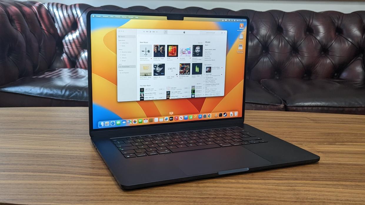  15-inch MacBook Air on wooden table at home. 