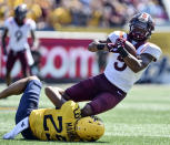 Virginia Tech wide receiver Tayvion Robinson (9) is tackled by West Virginia safety Sean Mahone (29) during the first half of an NCAA college football game in Morgantown, W.Va., Saturday, Sept. 18, 2021. (AP Photo/William Wotring)