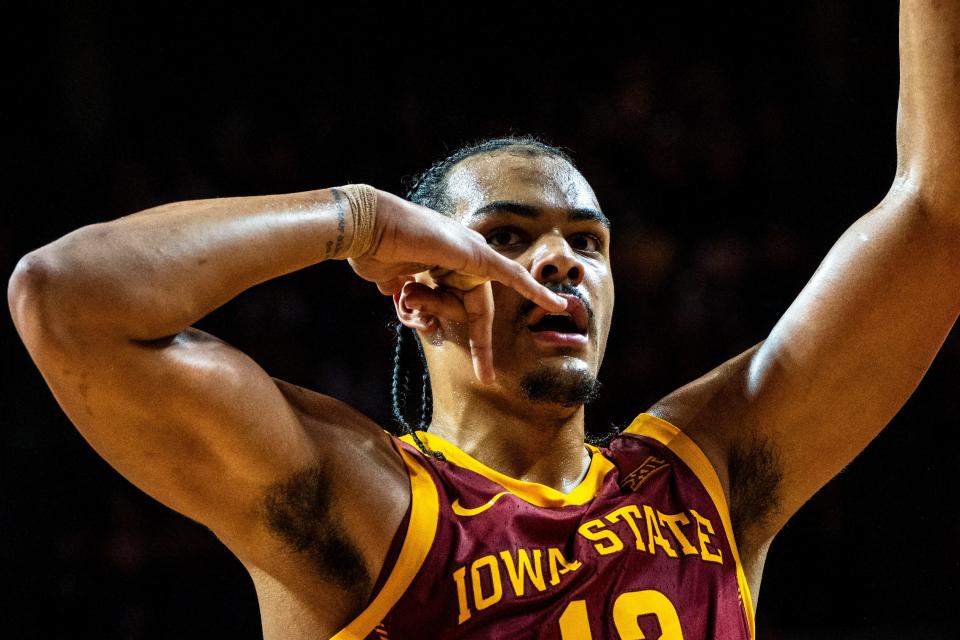 Iowa State's Robert Jones reacts to the cheering crowd as he makes his way to the bench in the second half.